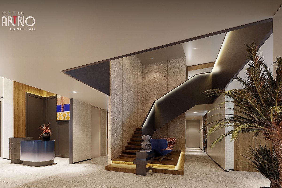 The Title Artrio — lobby with a sculptural staircase